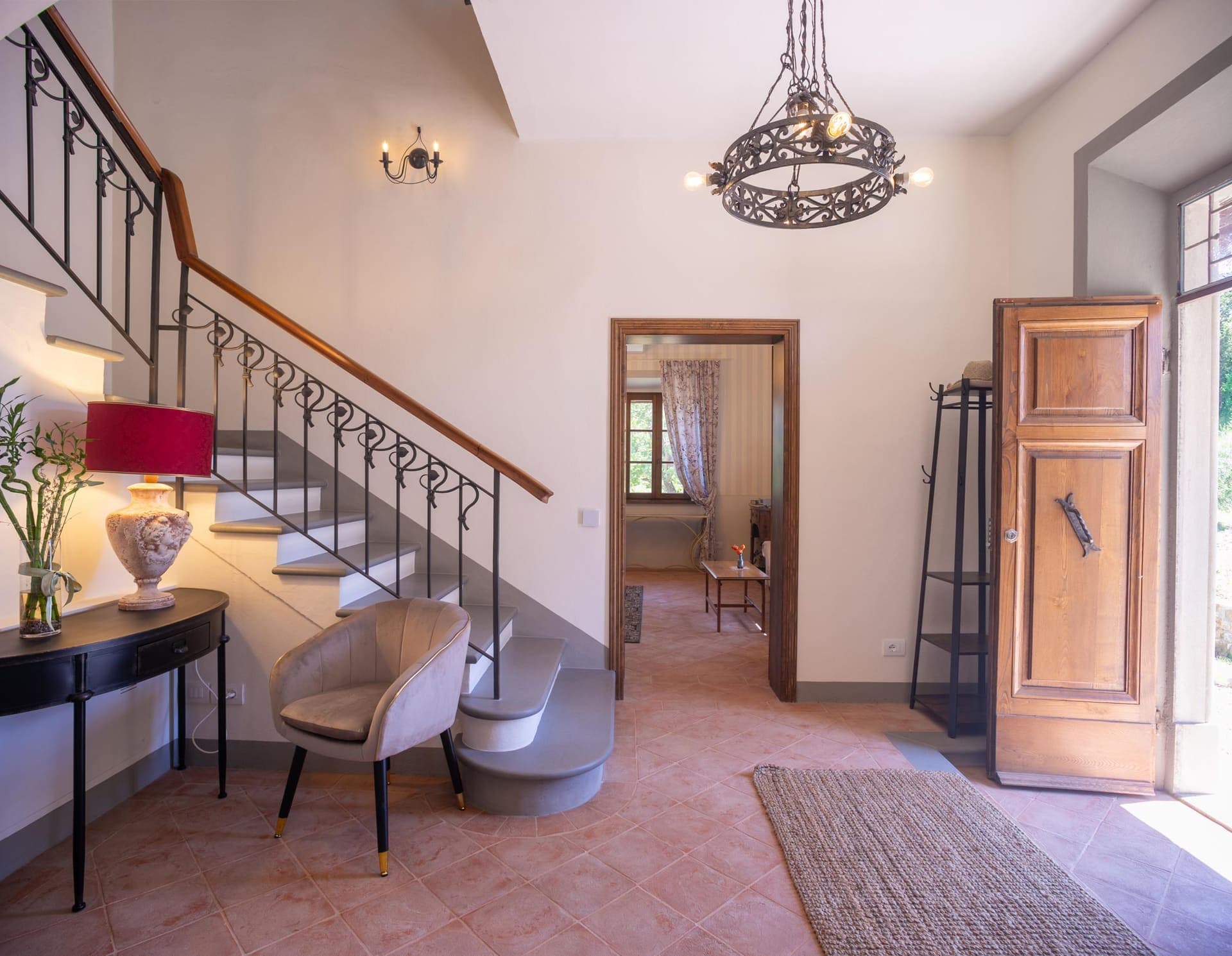 Villa entrance with sweeping staircase